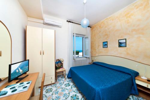 Кровать или кровати в номере Hotel Casa Di Meglio
