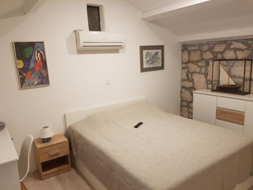 A bed or beds in a room at The Istrian
