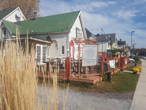 a house with a sign in front of it at 2-Bedroom Apartment #30A by Amazing Property Rentals in Gatineau