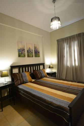 a bedroom with a large bed in a room at Mezapos Villa Katerina in Mézapos