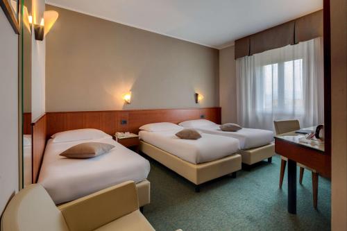 Krevet ili kreveti u jedinici u objektu Best Western Hotel Turismo