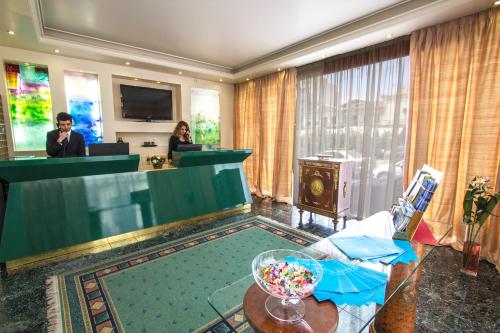 
a living room filled with furniture and a couch at Triton Hotel Piraeus in Piraeus
