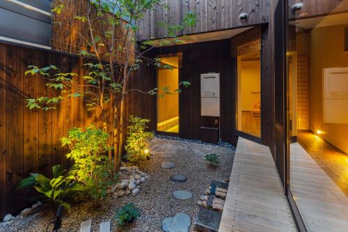 a garden in the middle of a house at Hisashi in Kyoto