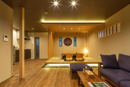 a living room with a couch and a table at Hisashi in Kyoto