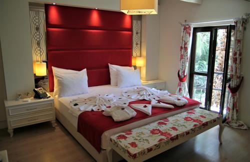 Ένα ή περισσότερα κρεβάτια σε δωμάτιο στο Baga Hotel