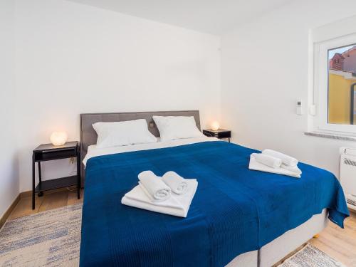 Appartments Adriatic tesisinde bir odada yatak veya yataklar