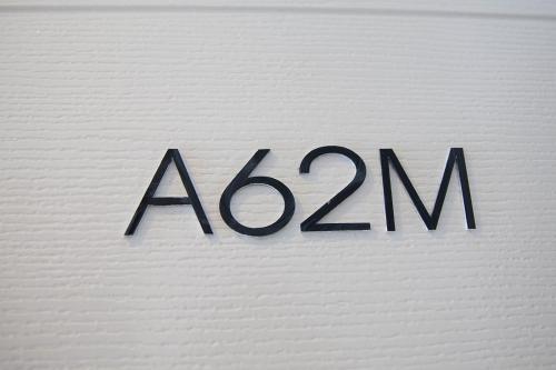 a zoo sign on the side of a white wall at Mosaic Condominium by Malai in Mae Pim