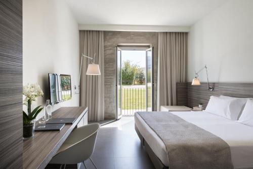 Postel nebo postele na pokoji v ubytování Hotel & Resort Le Colombare