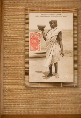 a framed picture of a woman holding a bowl at Ático con amplia terraza Nautilus II - VUT-480-AS in Luanco