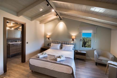 a bedroom with a large bed and a window at Summer Dream Lefkas in Lefkada Town