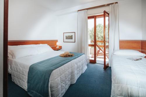 Un pat sau paturi într-o cameră la Hotel Argentina