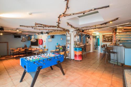 
a kitchen filled with tables and chairs at Jorplace Boutique Hostel in Scheveningen
