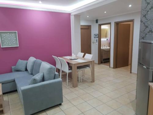 a living room with a couch and a table at Nina Apartment in Chania Town