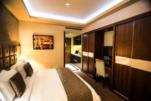 Postel nebo postele na pokoji v ubytování Gems Hotel