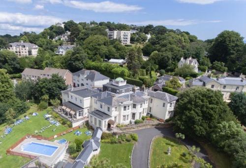 an aerial view of a large house with a swimming pool at Lincombe Hall Hotel & Spa - Just for Adults in Torquay