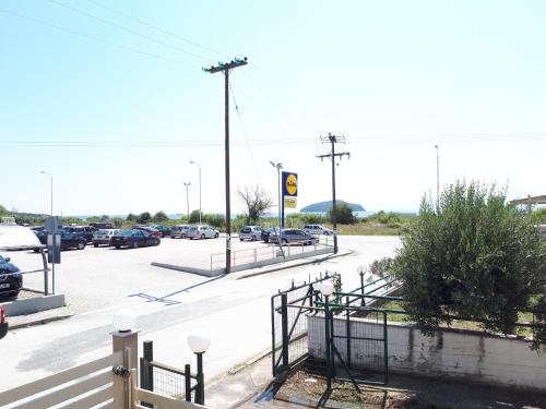 a parking lot with cars parked in a parking lot at New Sea & Sun House in Iraklitsa