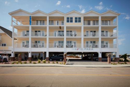 a large building with a car parked in front of it at The Hotel Maria in Westerly