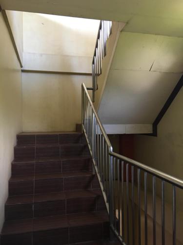 a staircase in a building with a stair case at Affordable La Union in Caba