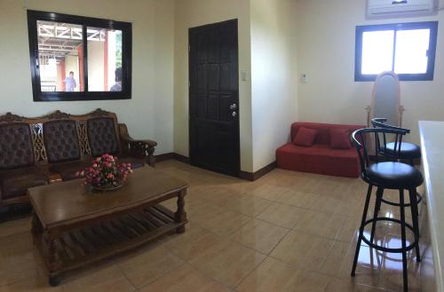 a living room with a couch and a table at Affordable La Union in Caba
