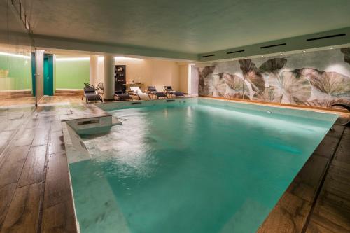 a large swimming pool in a large room at Mediterraneo Emotional Hotel & Spa in Santa Margherita Ligure
