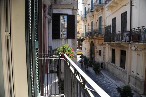 a view of an alley from a balcony of a building at Palazzo Grigio in Bari