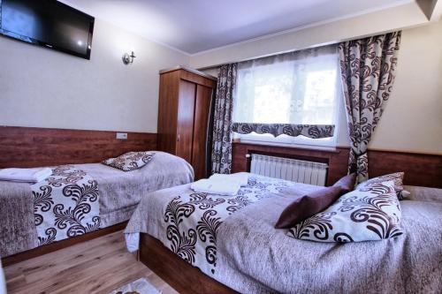 Una cama o camas en una habitación de Willa ZAKObystra