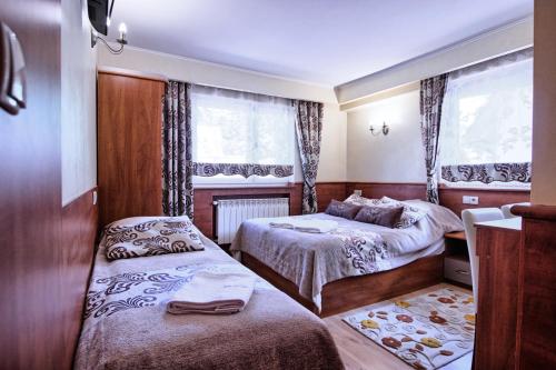 Una cama o camas en una habitación de Willa ZAKObystra