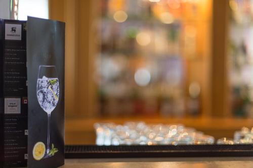 a wine glass in a box next to a group of glasses at Vila Baleira Porto Santo in Porto Santo