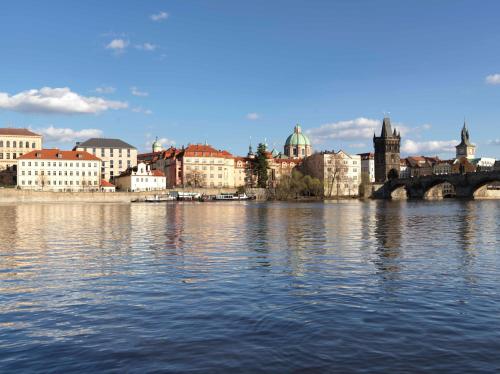 a view of a city with a river and buildings at Four Seasons Hotel Prague in Prague