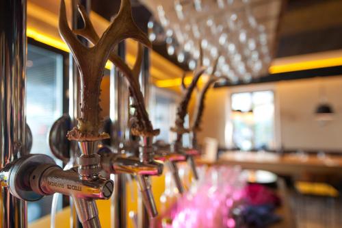 a row of utensils are lined up in a restaurant at Nala Individuellhotel in Innsbruck