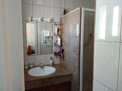 a bathroom with a sink and a mirror at Rio Manilva in San Luis de Sabinillas