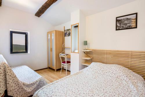Кровать или кровати в номере Chambre d'hotes - Ferme de Chanteraine