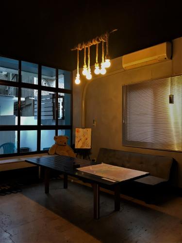 a living room with a table and a couch at Gather in Tainan