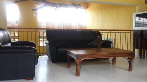a living room with a couch and a coffee table at Panorama Kakopleyri Kalabakas in Kakoplévrion