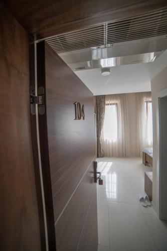 a room with a door with the number on it at Hotel Urban in Bužim