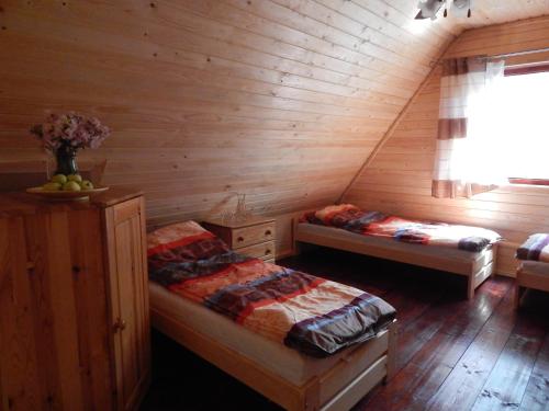 Postel nebo postele na pokoji v ubytování Grubałówka