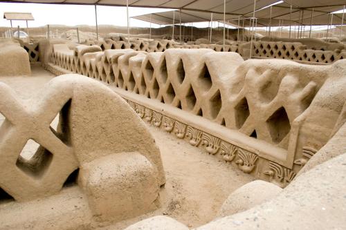 a sand sculpture of a bench in a building at Caballito de Totora in Huanchaco