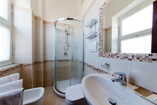 a bathroom with a sink and a shower at Hotel Casa Di Meglio in Ischia