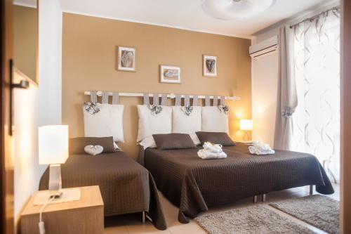 Postel nebo postele na pokoji v ubytování Pompei Suite