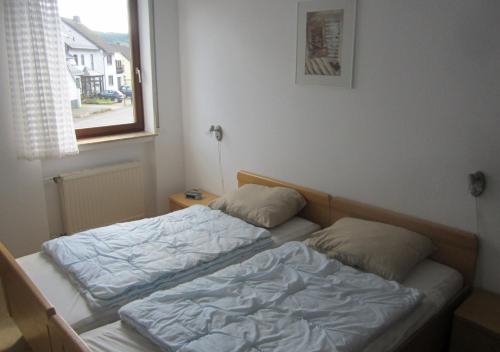 Postel nebo postele na pokoji v ubytování Ferienhaus Vulkaneifel Kopp