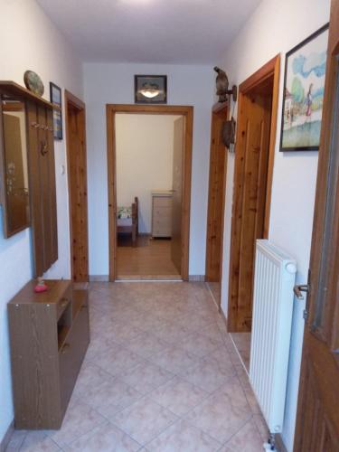 a room with a hallway with a door and a room with at Kuca za odmor Sarcevic in Prozor