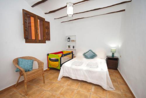 Ein Bett oder Betten in einem Zimmer der Unterkunft Casa La Posada de Chella