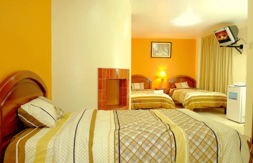Cama o camas de una habitación en Hotel Costa Norte