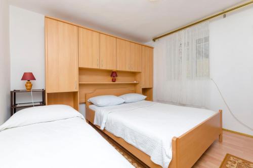Posteľ alebo postele v izbe v ubytovaní Apartments Visnja