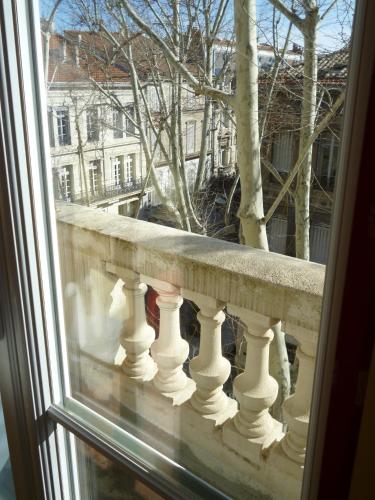 a view of a balcony from a window at Régina Boutique Hotel in Avignon