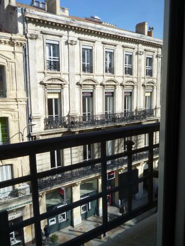 a view of a building from a window at Régina Boutique Hotel in Avignon