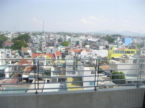 a view of a city from the balcony of a building at Indochine Hotel in Kon Tum