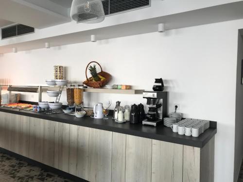 a kitchen with a counter with some food on it at Zlatni Zalaz,Apartments,Supetarska Draga in Supetarska Draga