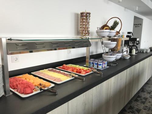 a buffet line with different types of food on display at Zlatni Zalaz,Apartments,Supetarska Draga in Supetarska Draga