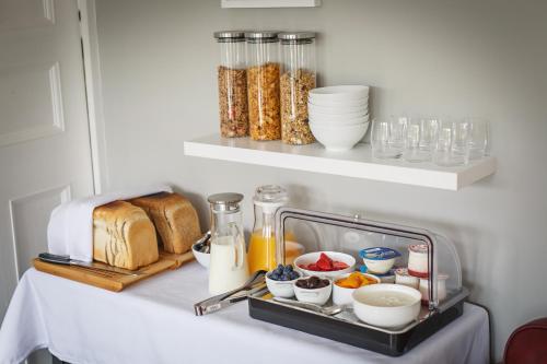 a kitchen counter with a tray of food on it at Alton House Sheringham in Sheringham